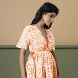 Right View of a Model wearing Orange Green Shibori Drop Shoulder Dress