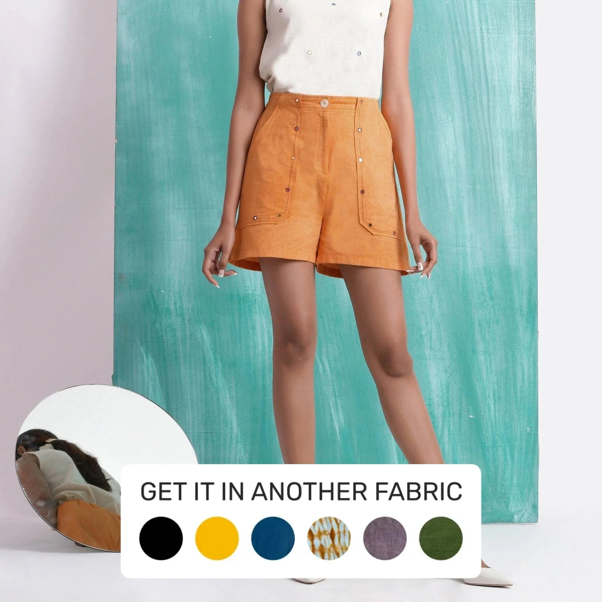 Front View of a Model wearing Orange Handspun Mirror Work Shorts