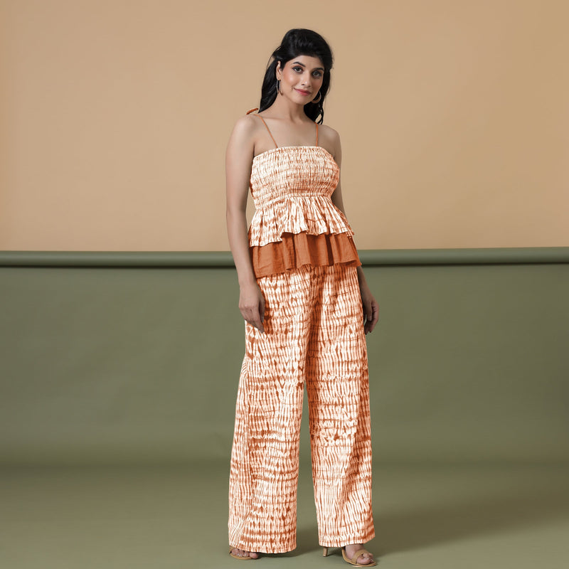 Right View of a Model wearing Orange Shibori Tier Camisole Top