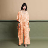 Front View of a Model wearing Orange Shibori V-Neck Kaftan Jumpsuit