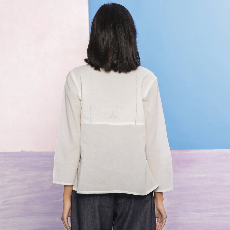 Back View of a Model wearing Organic Cotton Embroidered Split Neck Top