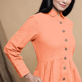 Front Detail of a Model wearing Peach Button Down Cotton Flax Knee Length Formal Dress