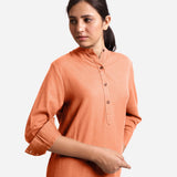 Front Detail of a Model wearing Peach Cotton Flax Shirt Dress