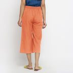 Back View of a Model wearing Peach Mid-Rise Cotton Flax Culottes