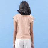 Back View of a Model wearing Peach Vegetable Dyed Handspun Cotton Essential Top