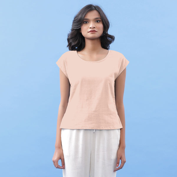 Front View of a Model wearing Peach Vegetable Dyed Handspun Cotton Essential Top