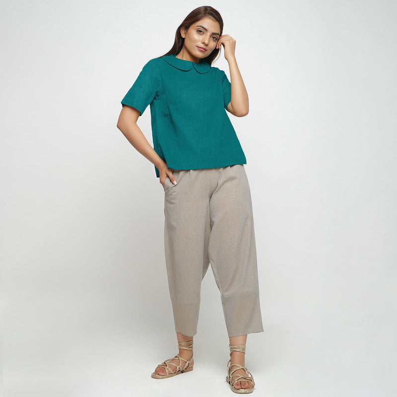 Front View of a Model wearing Pine Green 100% Linen A-Line Top