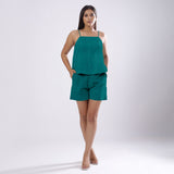 Front View of a Model wearing Pine Green 100% Linen Flared Camisole Top