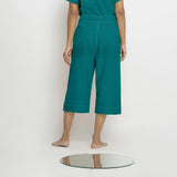 Back View of a Model wearing Pine Green 100% Linen Mid-Rise Culottes