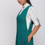 Left Detail of a Model wearing Pine Green 100% Linen Midi Pinafore Dress