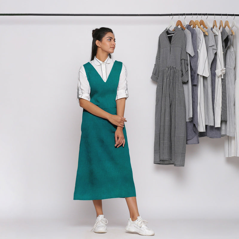 Front View of a Model wearing Pine Green 100% Linen Midi Pinafore Dress