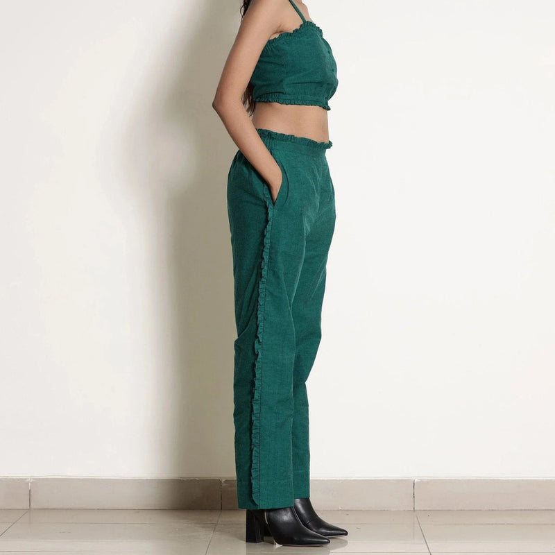 Right View of a Model wearing Pine Green Frill Warm Cotton Mid-Rise Paperbag Pant