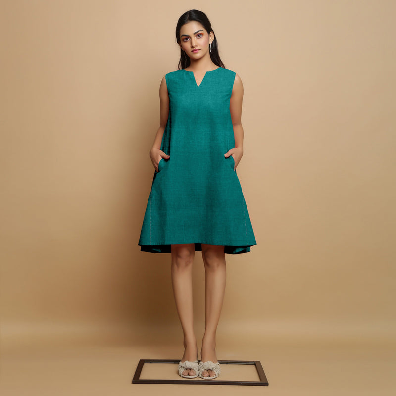 Front View of a Model wearing Pine Green Linen Hand Embroidered Knee-Length Godet Dress