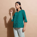 Left View of a Model wearing Pine Green Linen Split-Neck Straight Top