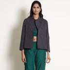 Front View of a Model wearing Pine Green Reversible Asymmetric Jacket