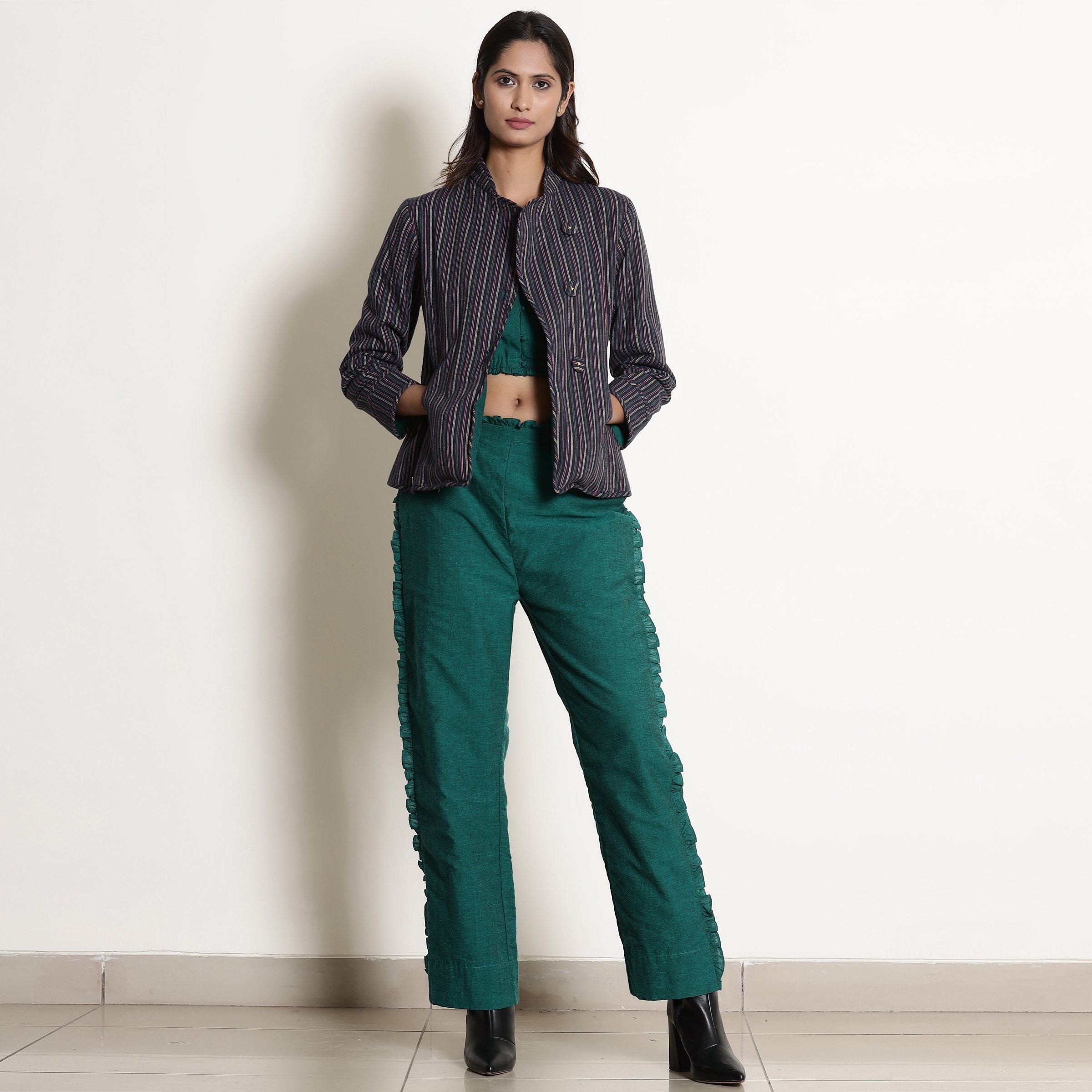 Front View of a Model wearing Pine Green Reversible Asymmetric Jacket
