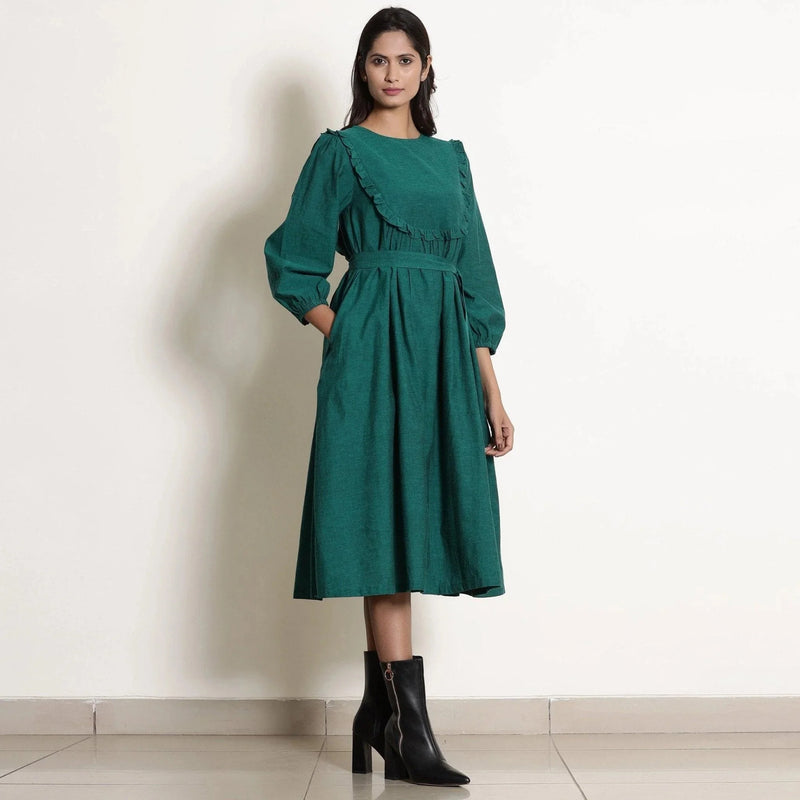 Right View of a Model wearing Pine Green Warm Cotton Frilled Midi Yoke Dress