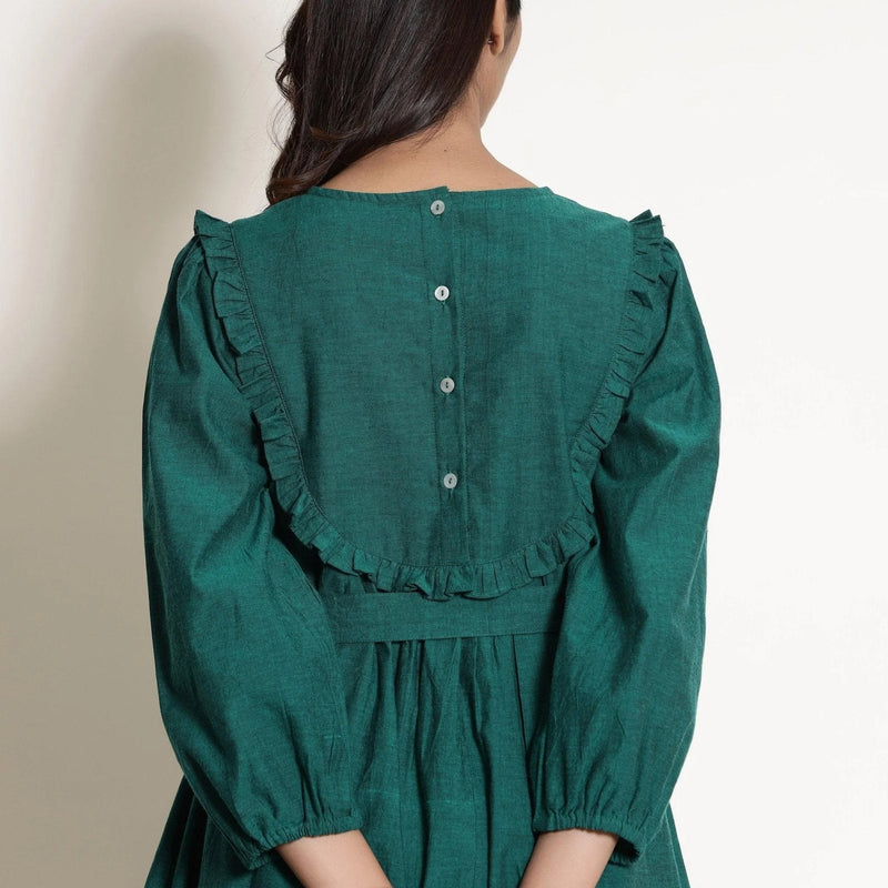 Front Detail of a Model wearing Pine Green Warm Cotton Frilled Midi Yoke Dress