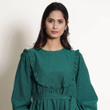 Front Detail of a Model wearing Pine Green Warm Cotton Frilled Midi Yoke Dress