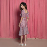 Left View of a Model wearing Pink Chanderi Hand Block Print Peplum Skirt