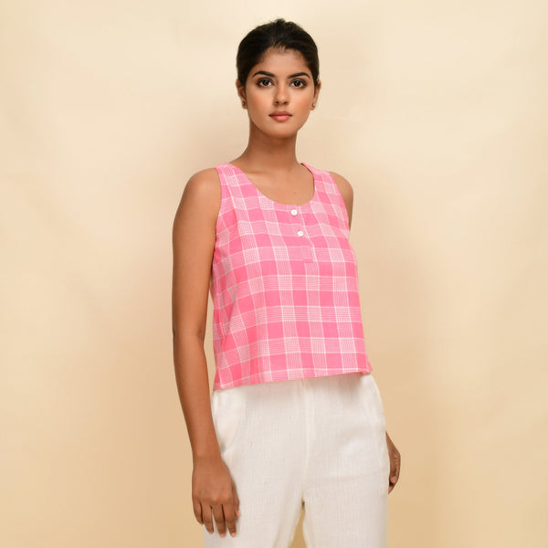 Right View of a Model wearing Pink Checks Cotton Muslin Sleeveless Round Neck Top