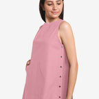 Left Detail of a Model wearing Pink Cotton Flax Kangaroo Pocket Dress