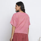 Left View of a Model wearing Pink Handspun Yoked Anti-Fit Top