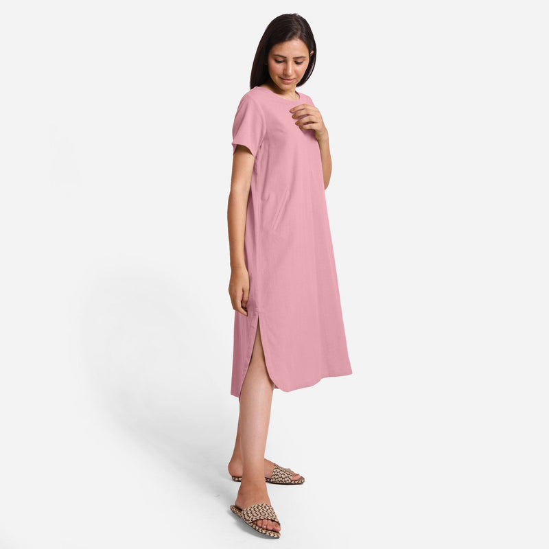 Right View of a Model wearing Pink Cotton Welt Pocket Shift Dress