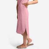 Left View of a Model wearing Pink Cotton Welt Pocket Shift Dress