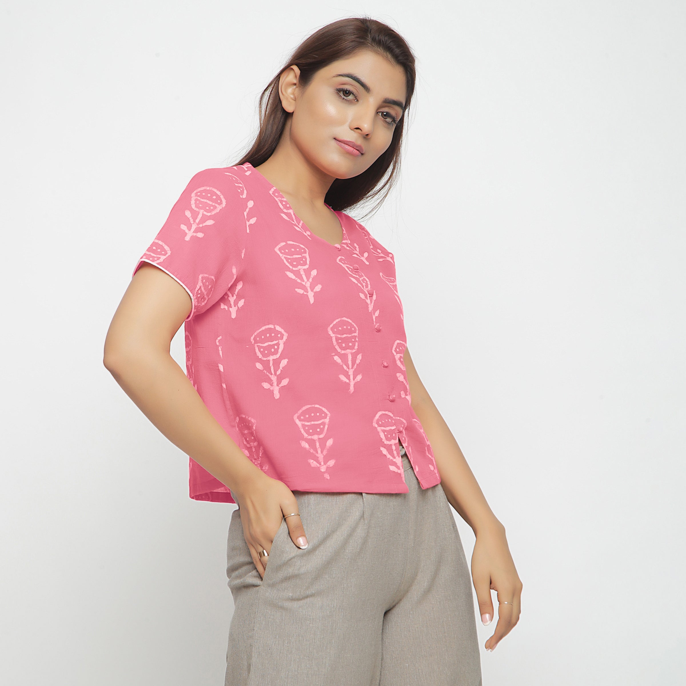 Right View of a Model wearing Pink Dabu Floral Block Print Button-Down Cotton Top