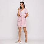 Left View of a Model wearing Pink Ditsy Block Print Cotton Short Romper