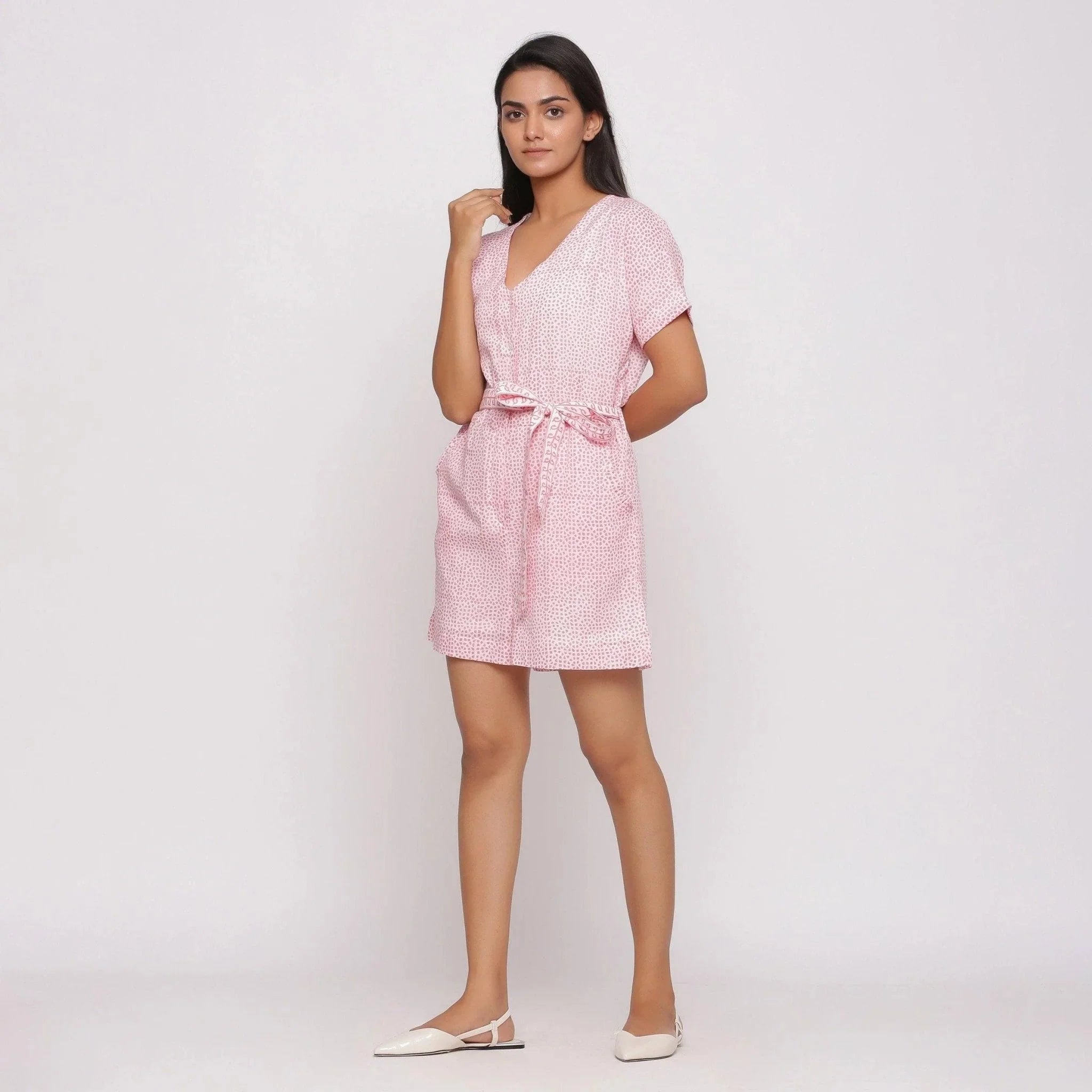Left View of a Model wearing Pink Ditsy Block Print Cotton Short Romper