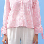 Detail View of a Model wearing Pink Hand Block Printed Button-Down Blouse