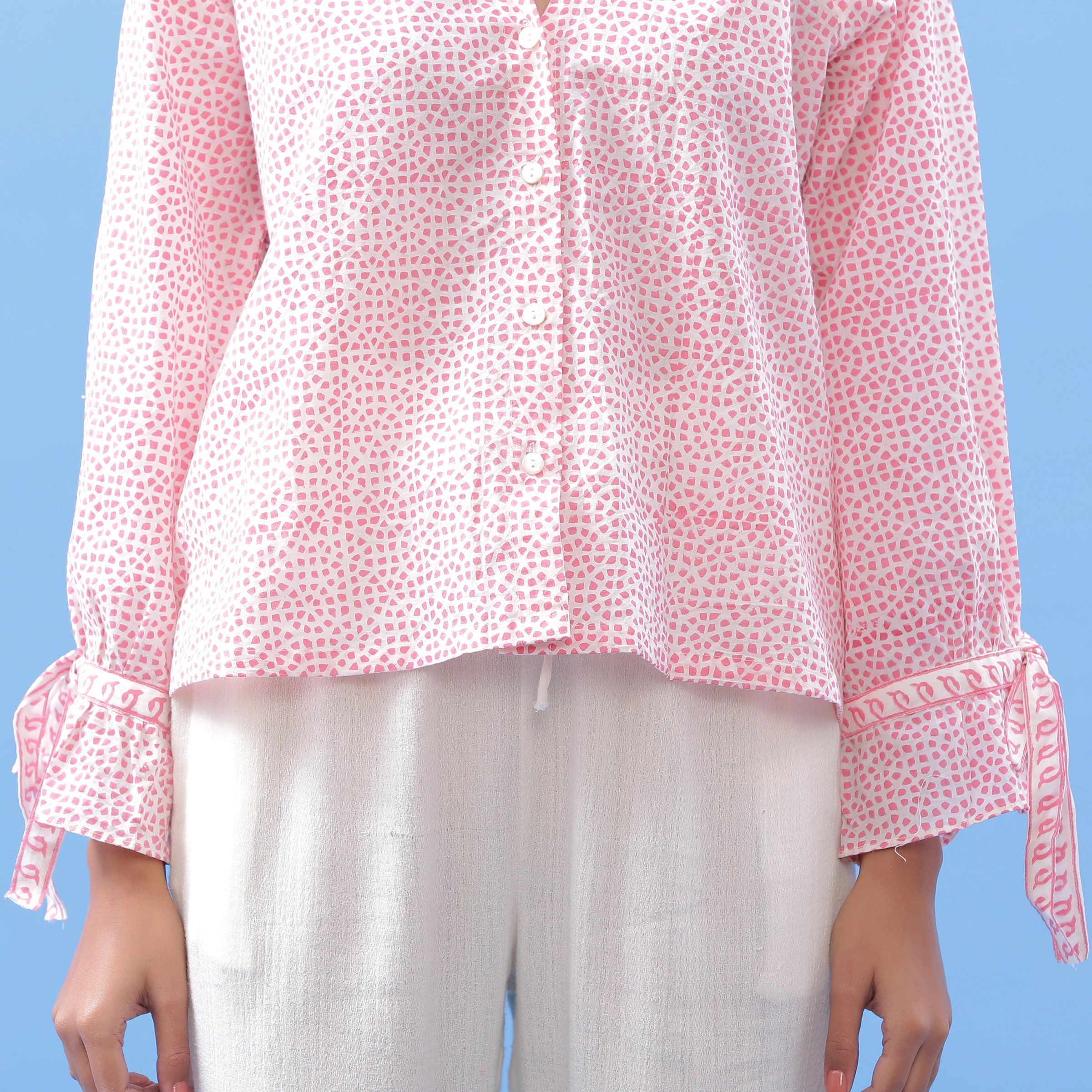 Detail View of a Model wearing Pink Hand Block Printed Button-Down Blouse