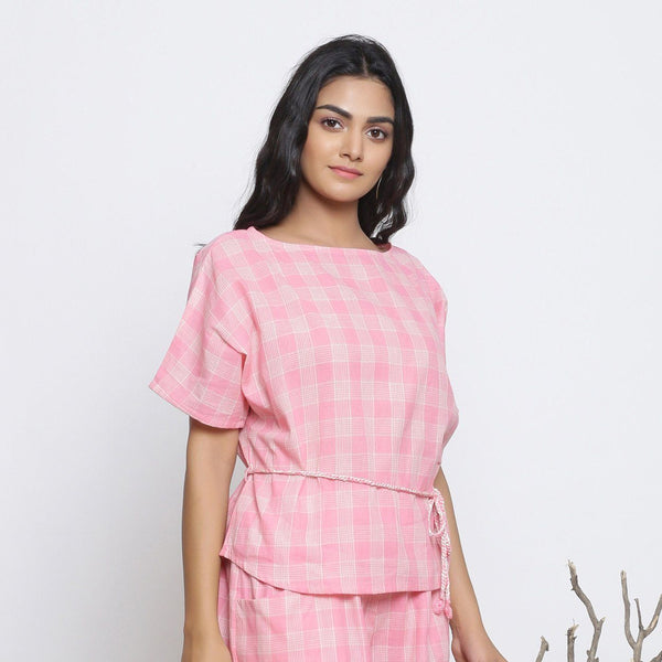 Right View of a Model wearing Pink Checks Handspun Cotton Muslin Loose Fit Boat Neck Top