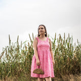 Front View of a Model wearing Pink Paisley Fit and Flare Cotton Dress