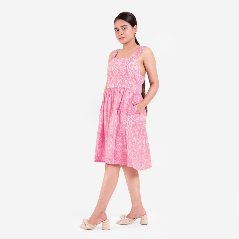 Left View of a Model wearing Pink Paisley Fit and Flare Cotton Dress