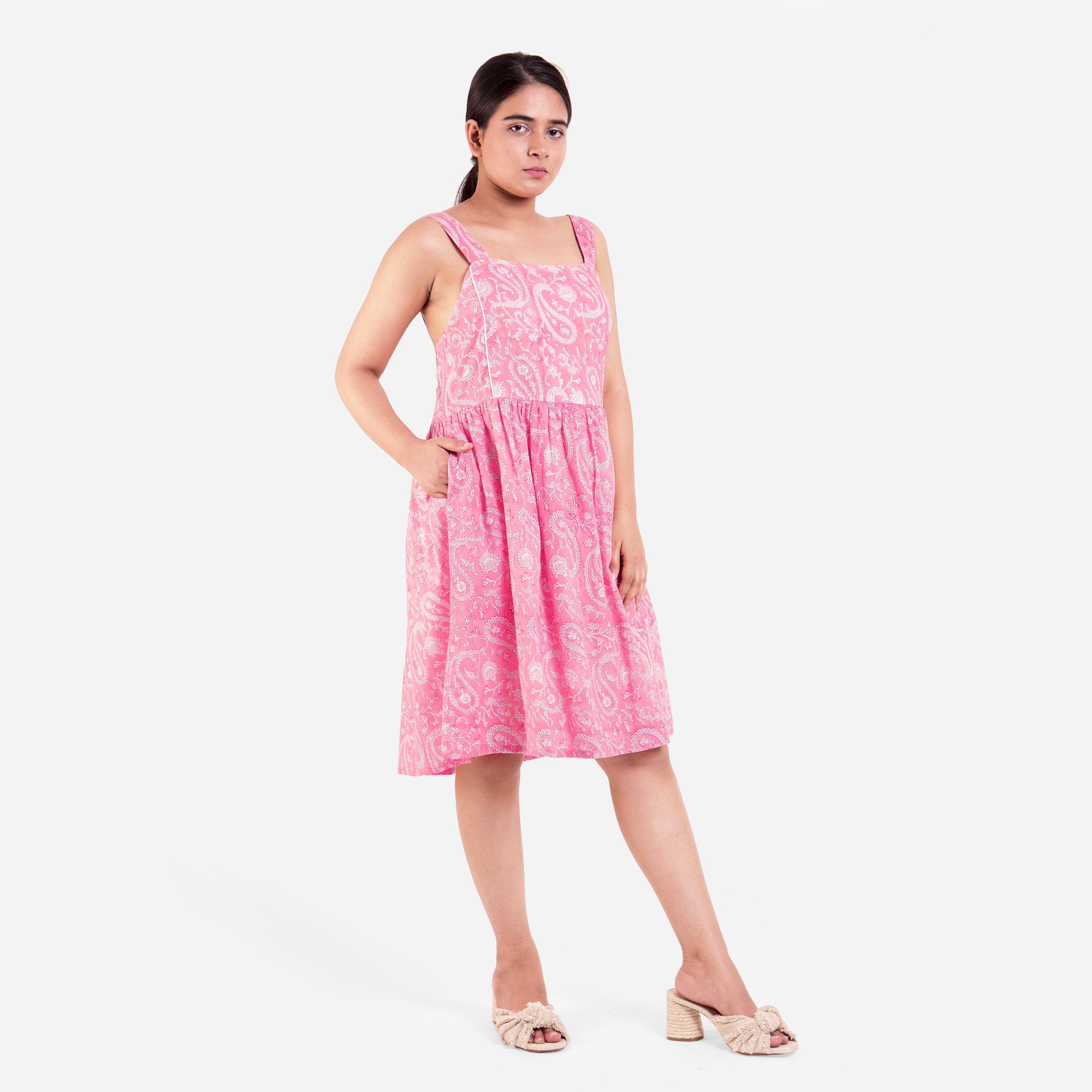 Right View of a Model wearing Pink Paisley Fit and Flare Cotton Dress