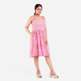 Right View of a Model wearing Pink Paisley Fit and Flare Cotton Dress