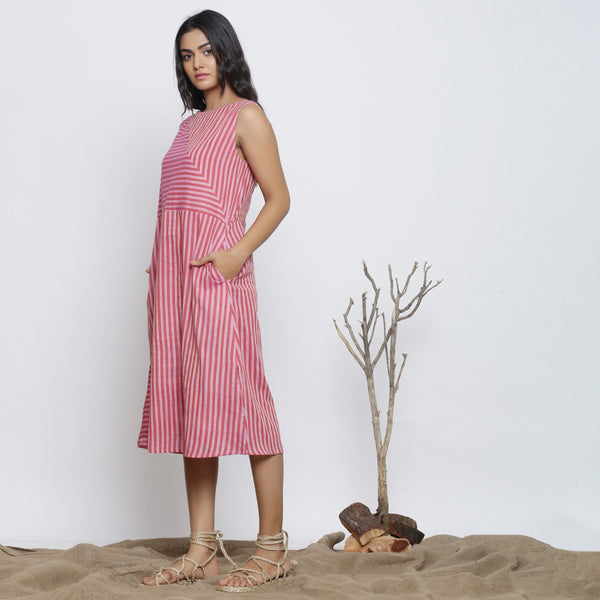 Left View of a Model wearing Pink Striped Sleeveless Paneled Dress