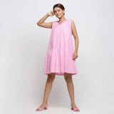 Front View of a Model wearing Pink Tie and Dye 100% Cotton Tiered V-Neck Short Dress