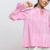 Front Detail of a Model wearing Pink Tie-Dye 100% Cotton Shirred Blouson Top