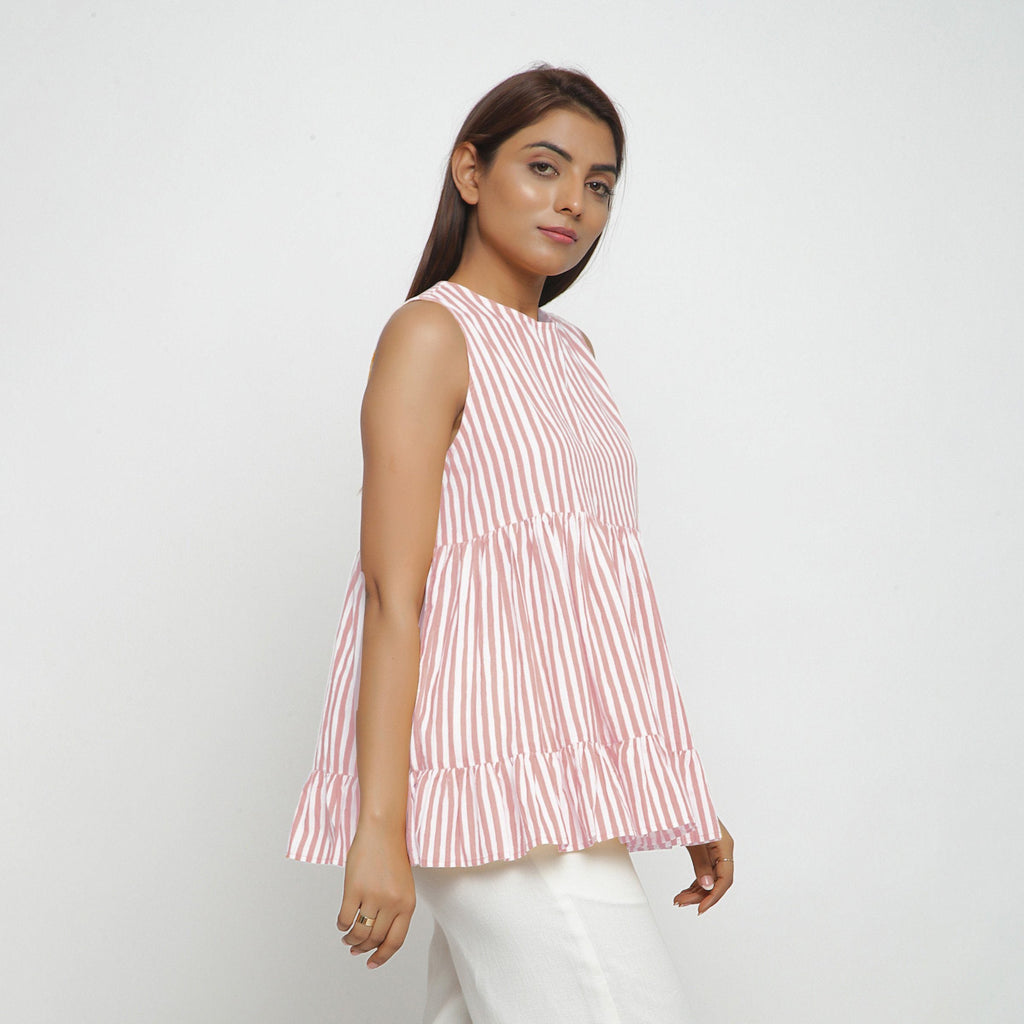 Left View of a Model wearing Pink Tiered Hand Screen Printed Top