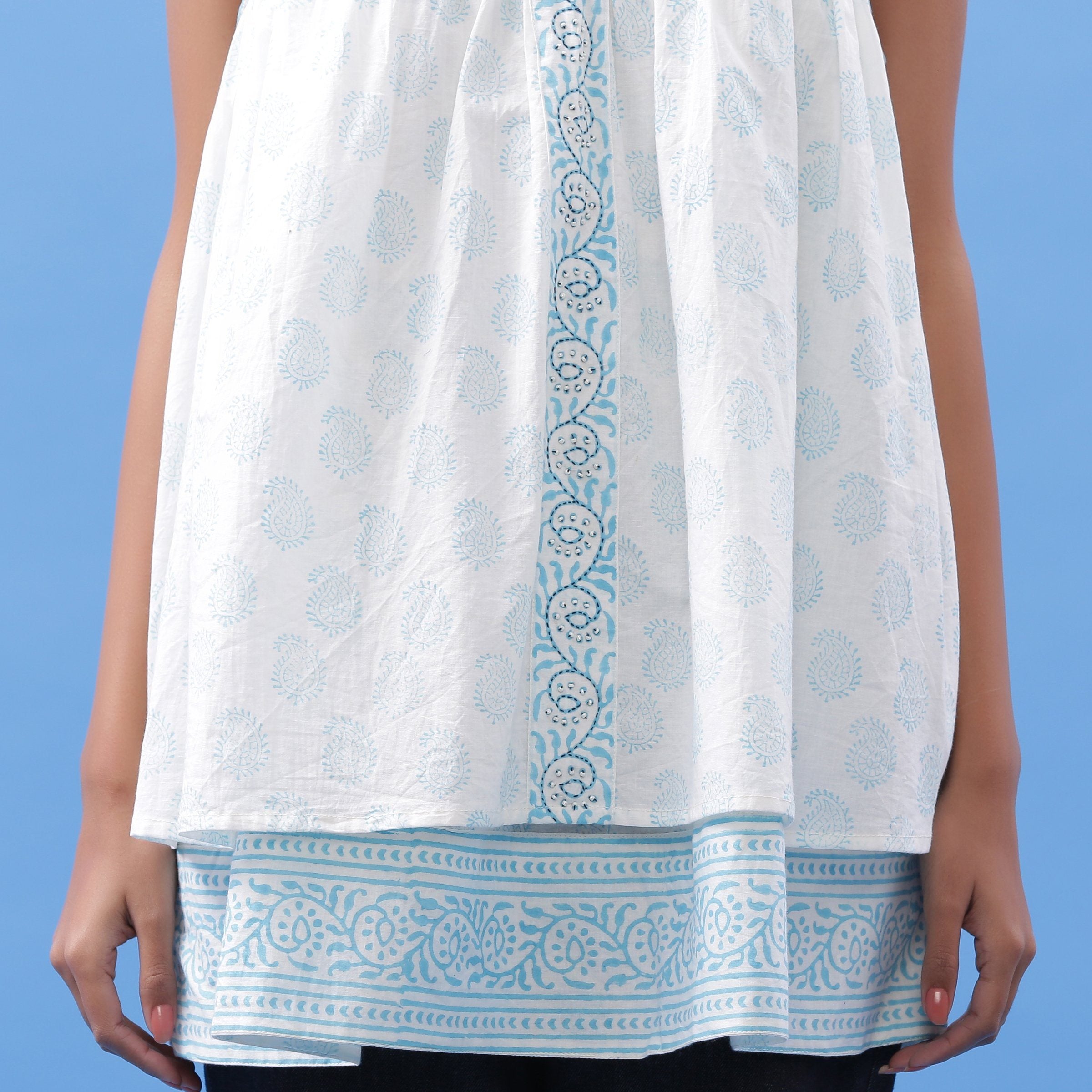 Front Detail of a Model wearing Powder Blue Block Printed V-Neck Tunic Top