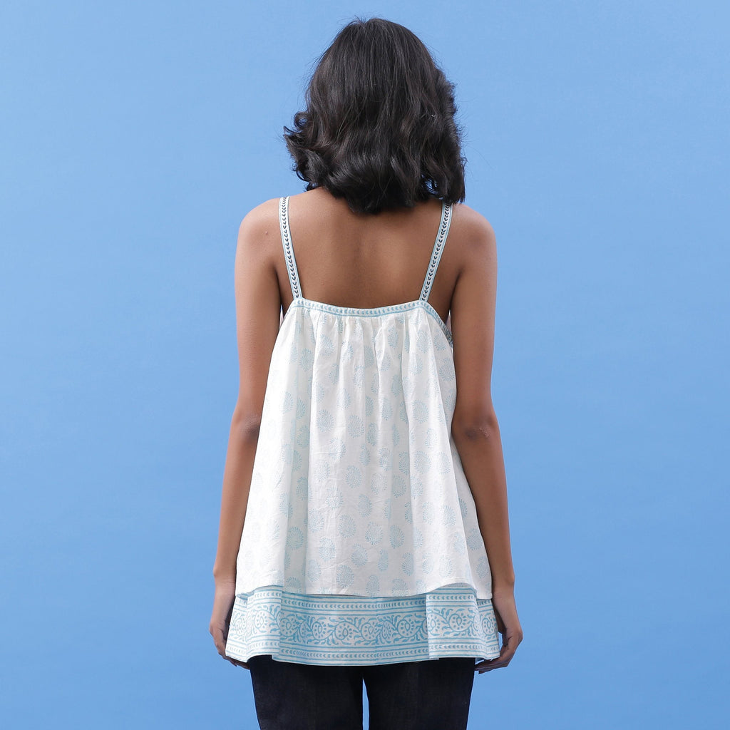 Back View of a Model wearing Powder Blue Block Printed V-Neck Tunic Top