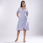 Front View of a Model wearing Powder Blue Handspun Plunge Neck Wrap Dress