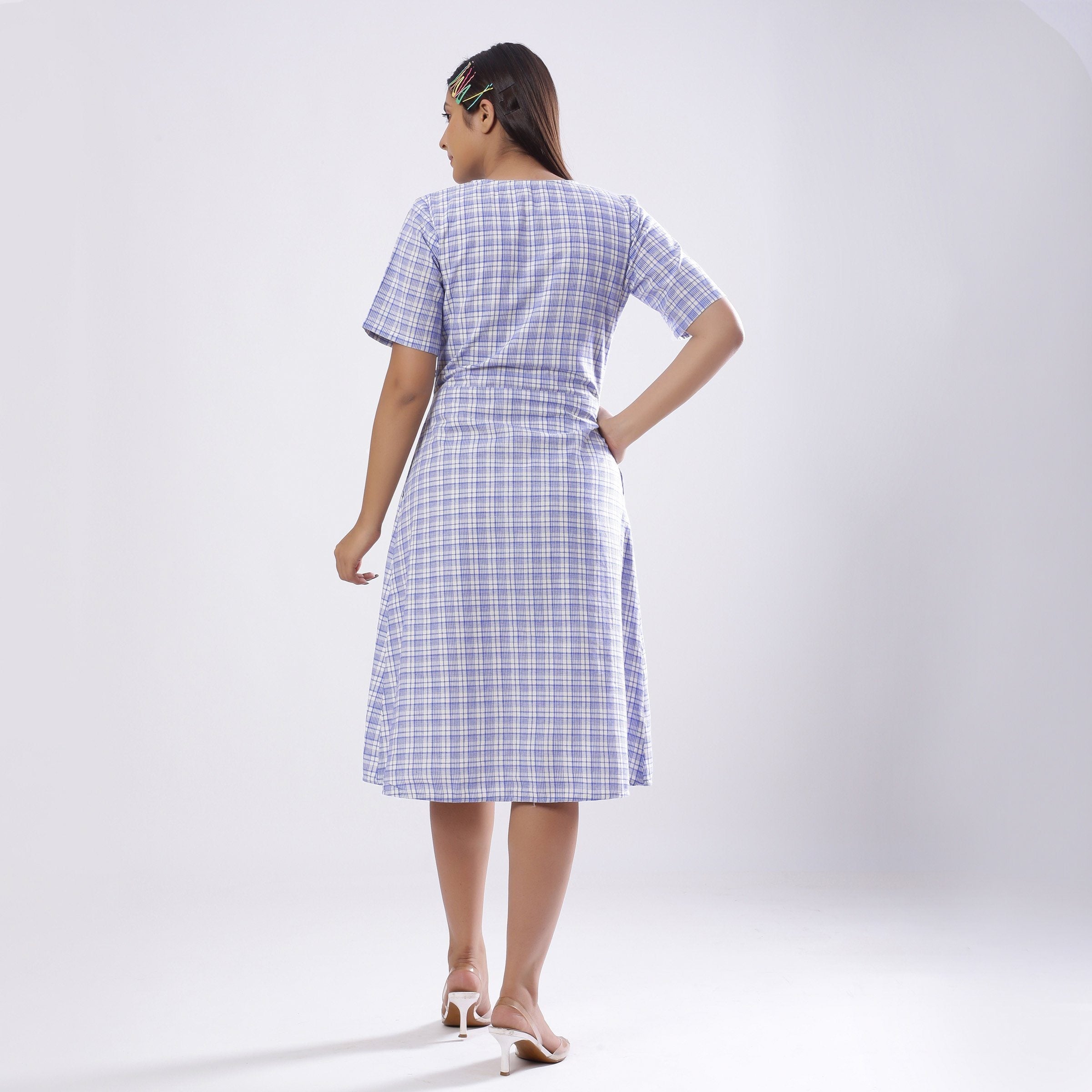 Back View of a Model wearing Powder Blue Handspun Plunge Neck Wrap Dress