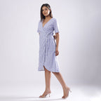 Front View of a Model wearing Powder Blue Handspun Plunge Neck Wrap Dress