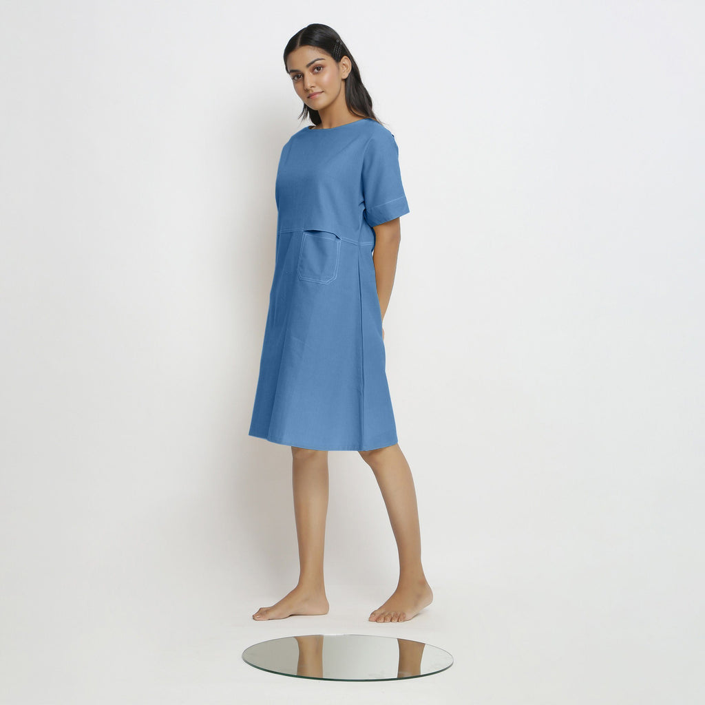 Left View of a Model wearing Powder Blue Handspun Vegetable Dyed Yoked Dress