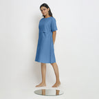 Left View of a Model wearing Powder Blue Handspun Vegetable Dyed Yoked Dress